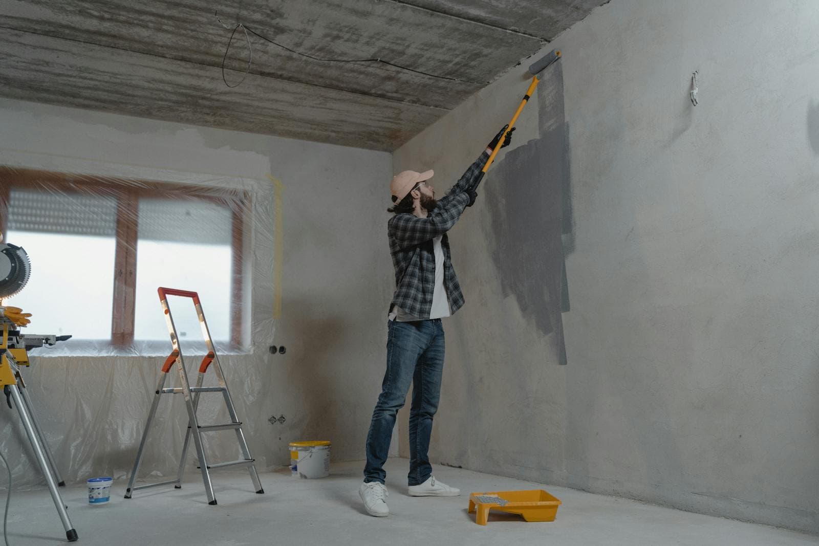 Cabinet and interior painting prep with a roller